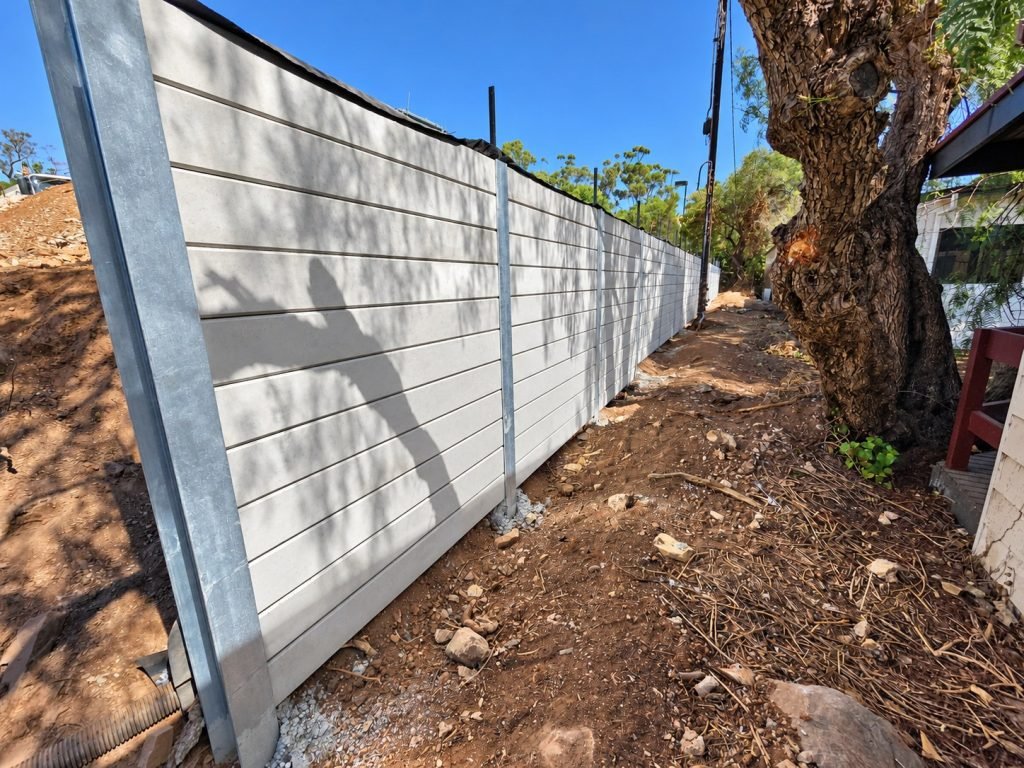 Grey concrete sleeper wall by Retain The Earth
